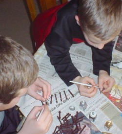 Photo of kids painting the pieces